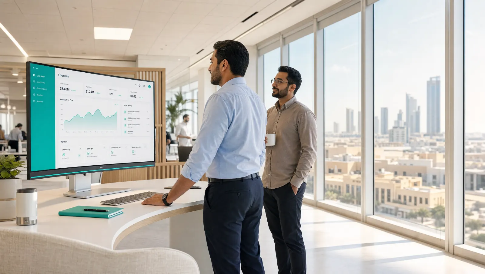 Bright enterprise office with in-box.ai workflow and AI operations dashboards.